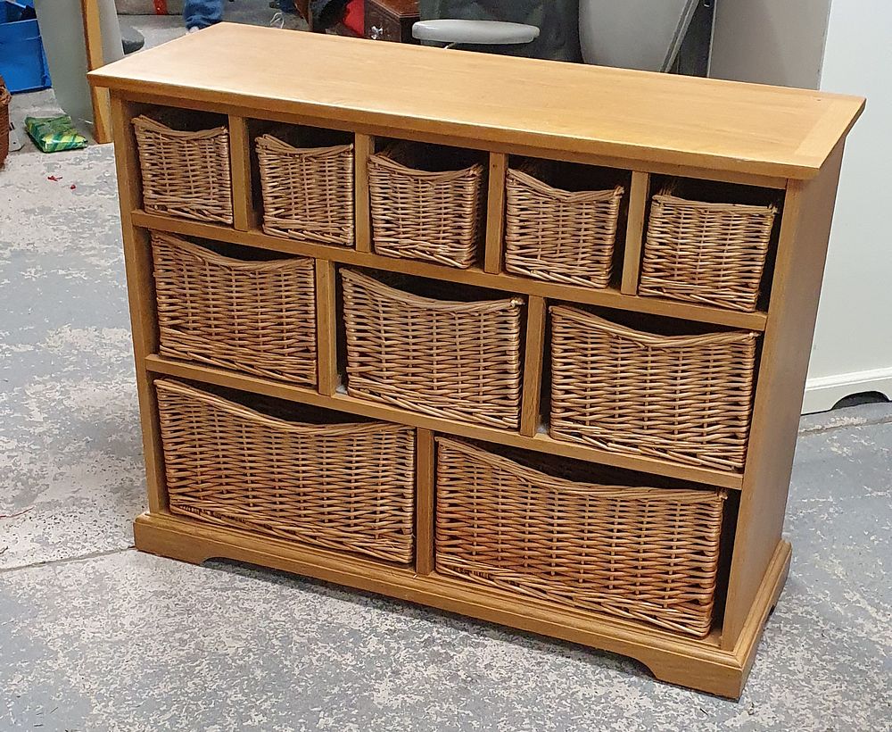 Lot 224: Wooden storage unit with 10 wicker drawers