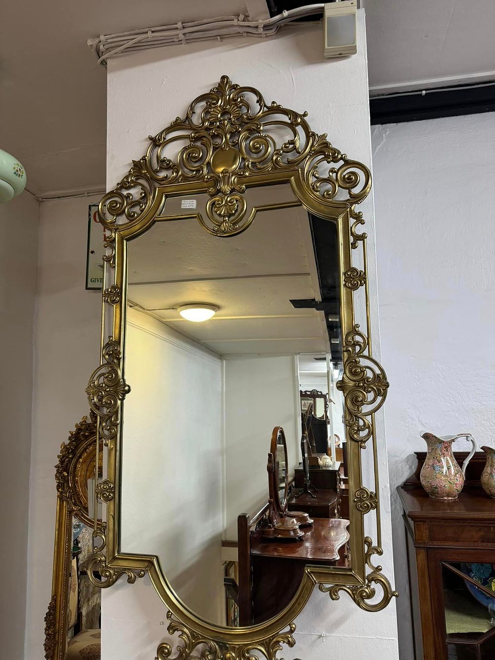 Lot 276: A Large Mid century Italian Brass pier mirror