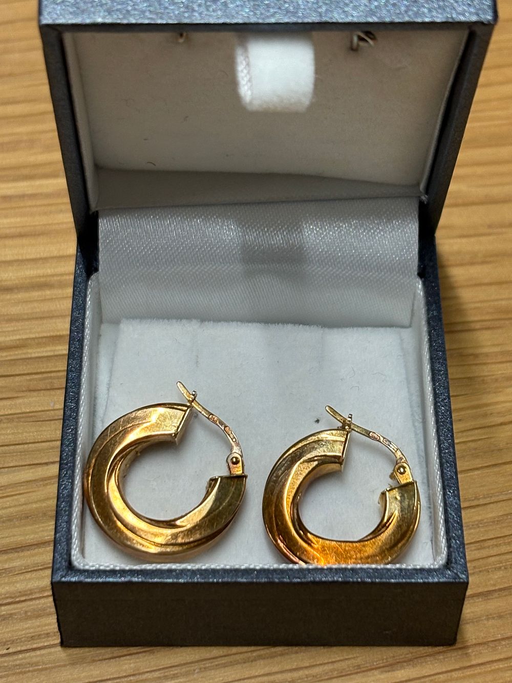 Lot 303: Pair of 9 Carat Gold Earrings