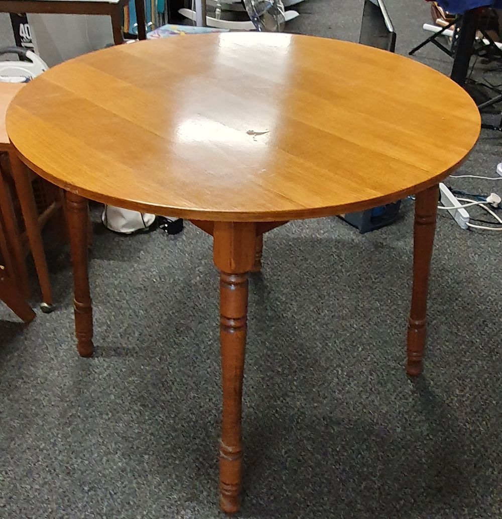 Lot 193: Round wooden dining table