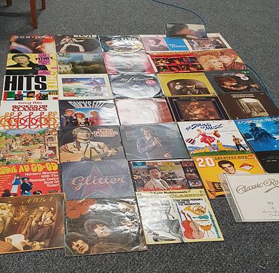 35 vinyl LP records. Includes Elvis , Beatles , Bon Jovi , Shirley Bassey , Cliff Richard and others