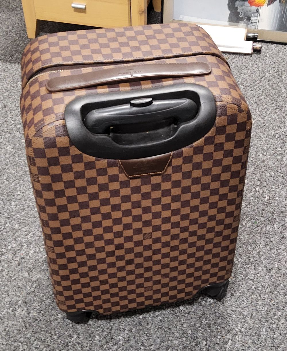 Lot 210: Lightwieght Suitcase.