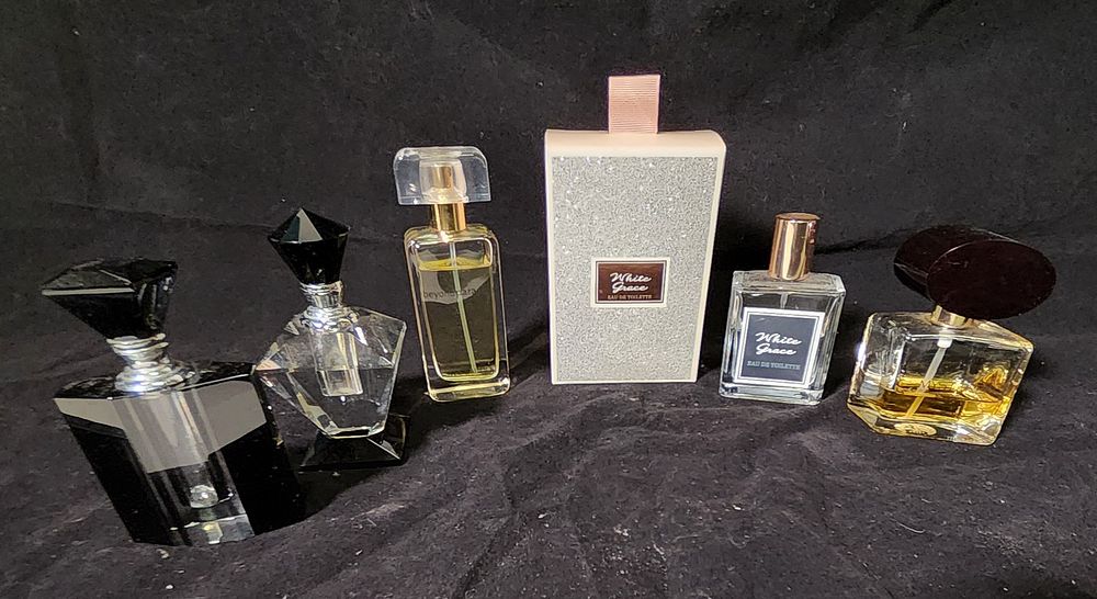 Lot 255: Selection of perfume and bottles to include Estee Lauder and Dior