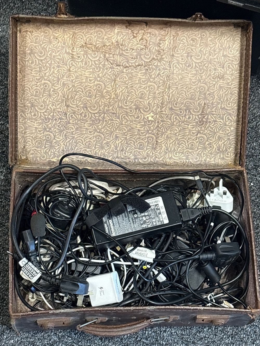 Lot 16a: Case full of power adapters and leads