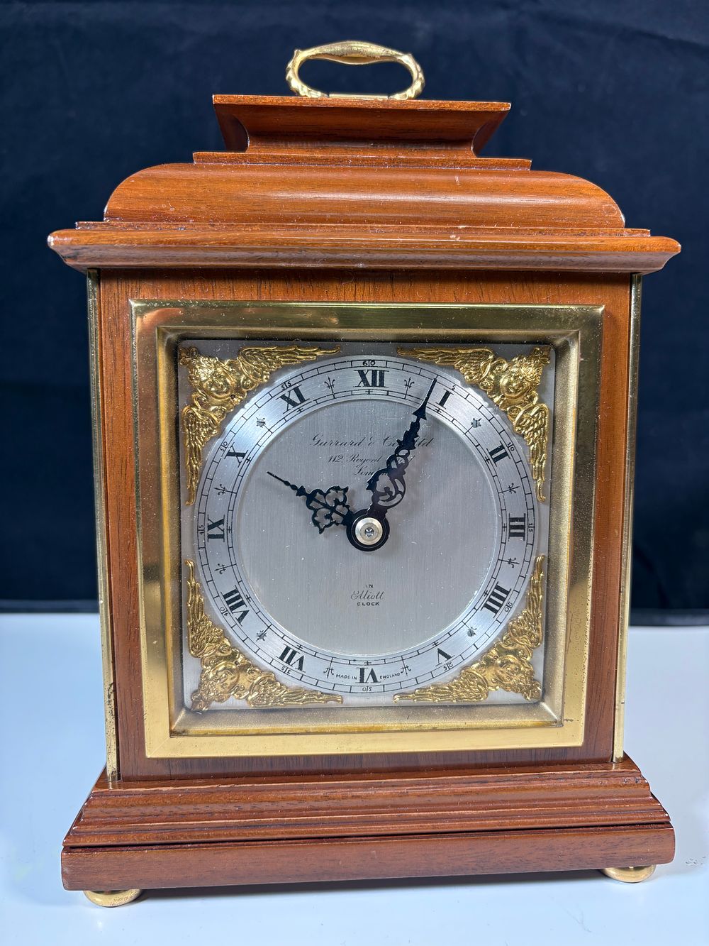 Lot 189:  Elliott mantel clock with a mahogany case, retailed by Garrard & Co.