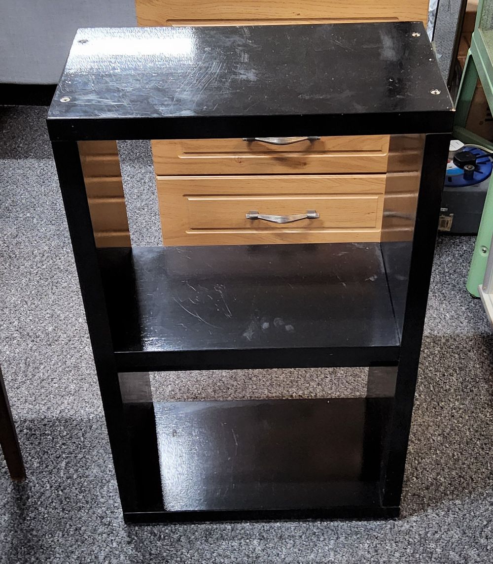 Lot 176: Black shelves.