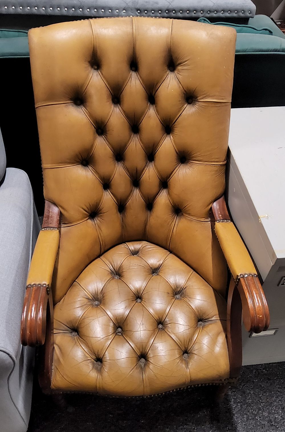Lot 179: Antique Chesterfield Button tuft tan leather Library chair