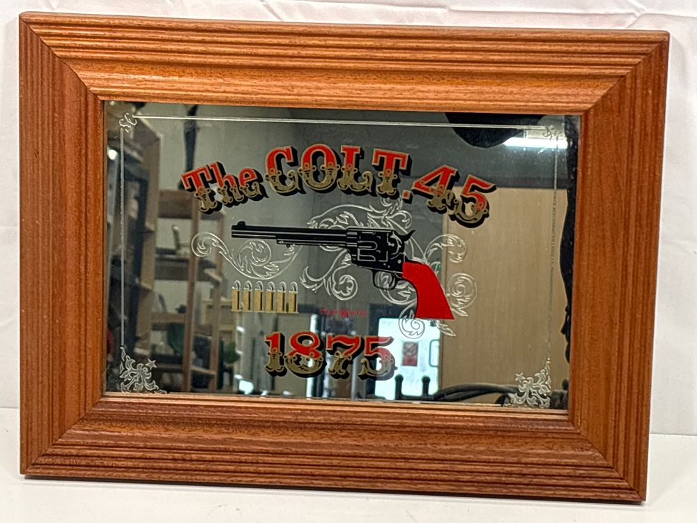 Lot 197: Mirrored Framed Repro Colt 45 Advert