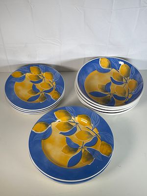 Unused 4 place dinner service . Four dinner plates , four bowls and four side plates