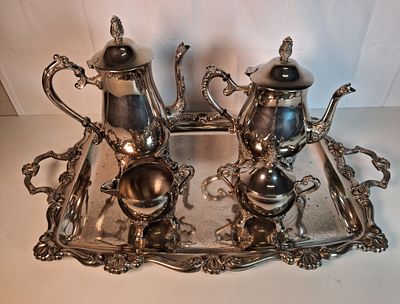 Silver plated coffee and tea set . Five piece silver plated coffee and tea set .