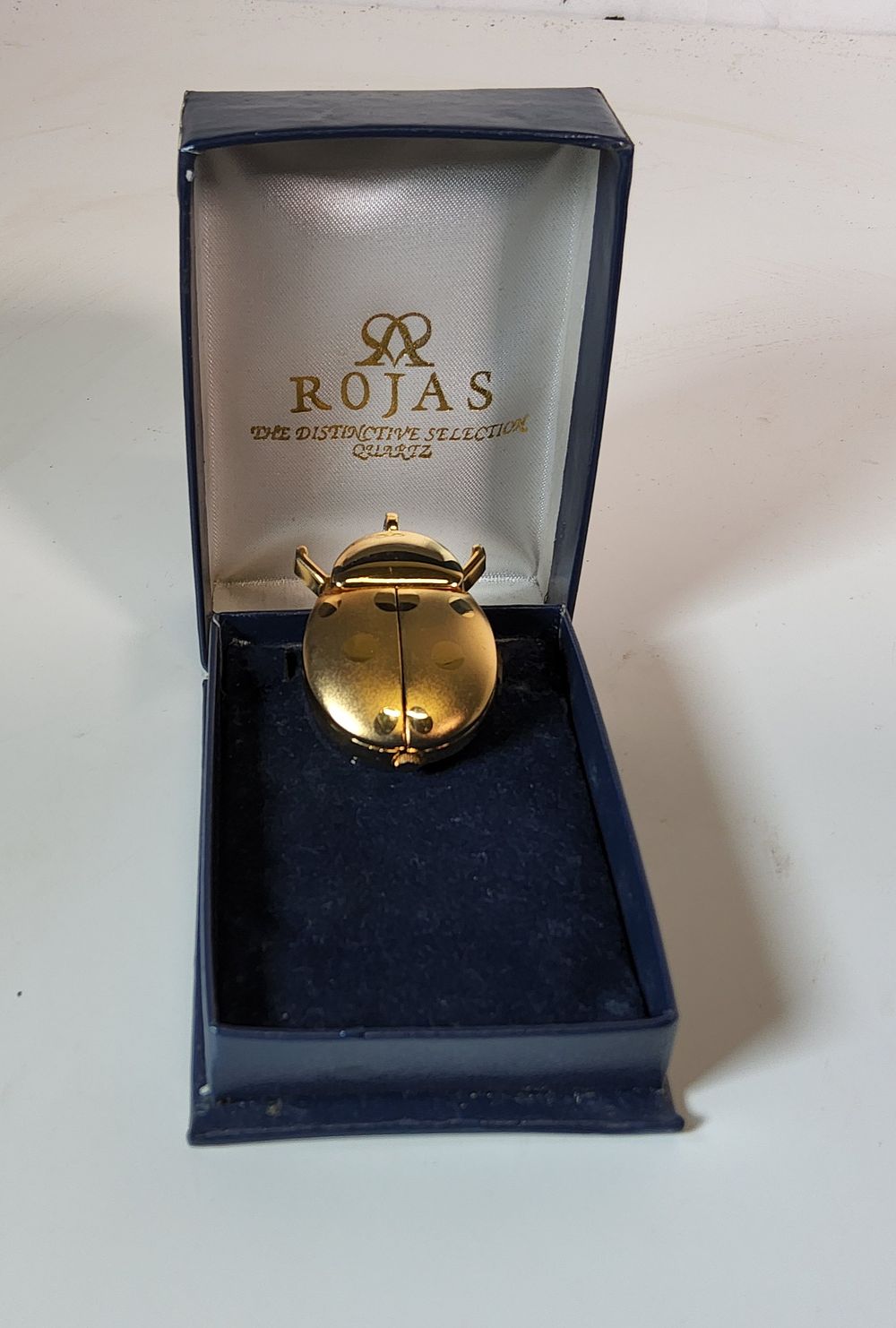 Lot 208: ROJAS gold-tone ladybug quartz watch pendant