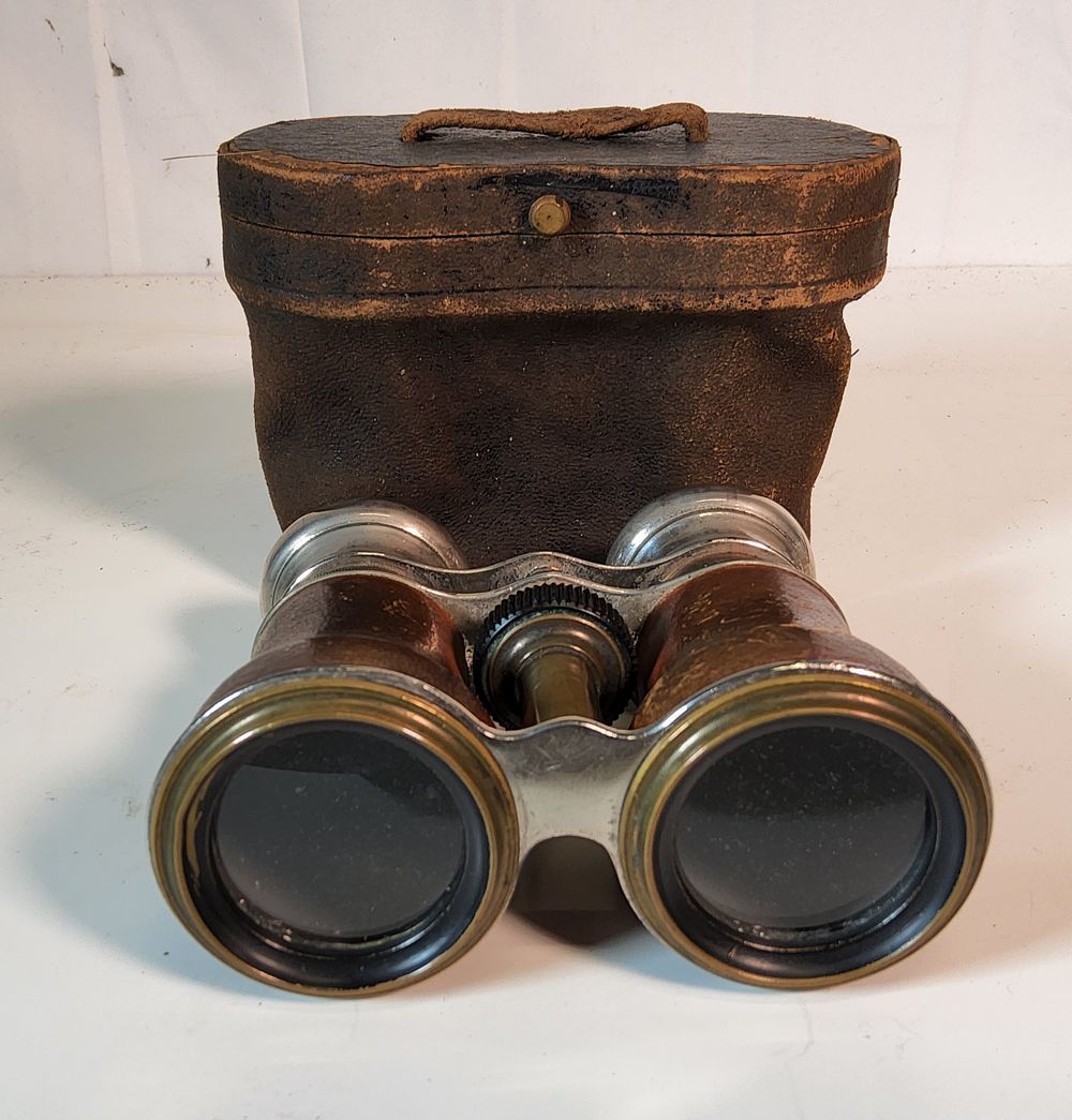 Lot 215: ANTIQUE LEATHER BOUND RACING OPERA BINOCULARS. With Leather case .