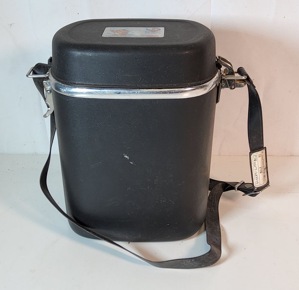 Lot 227:  Vintage Zojirushi Mr. Bento vacuum insulated lunch jar set
From the 1988 Seoul Olympics. Height 9".