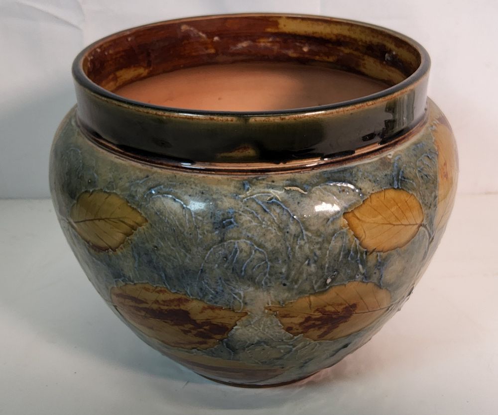 Lot 232: Royal Doulton jardiniere or garden pot planter with an "Autumn Leaves" design. 

Diameter 8".