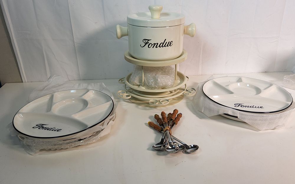Lot 234: Party Fondue Set with Recipe booklet .
As pictured.