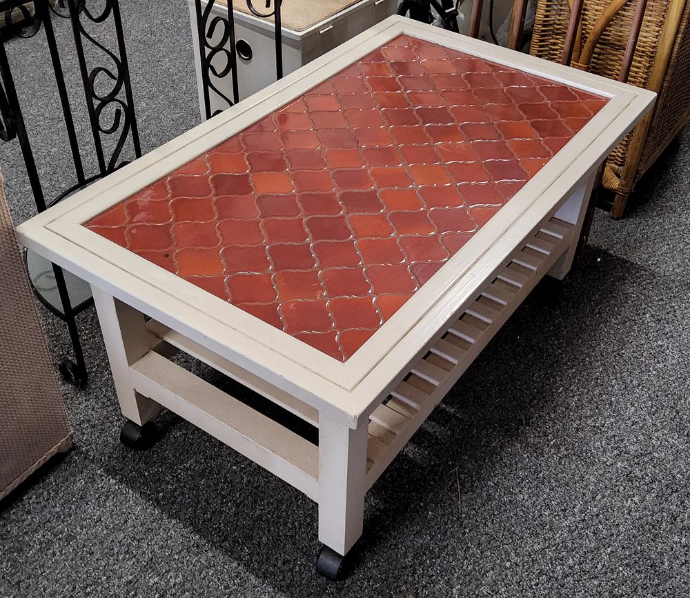 Lot 260: Tiled topped Coffee Table 36 x 21.5".
On Castors.