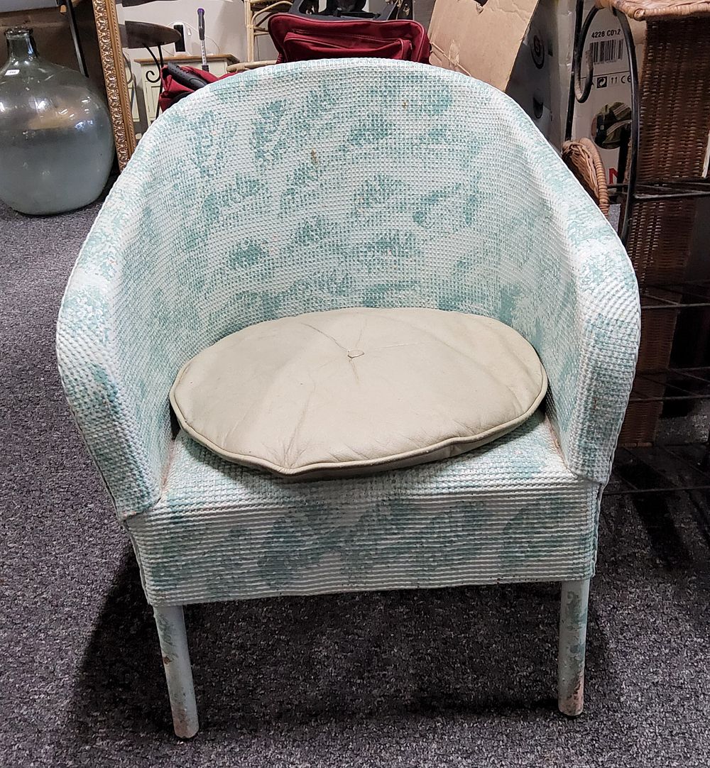 Lot 272: Lloyd loom style Armchair. As pictured.