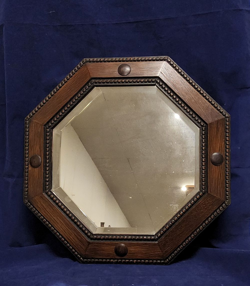 Lot 114a: Antique English Jacobean or Tudor style carved oak octagonal bevelled wall mirror. Circa 1920s