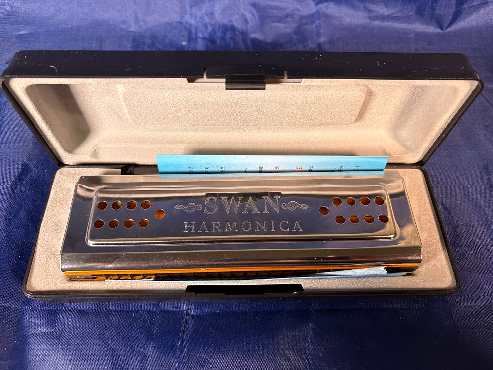 Lot 164: Double 24 Hole harmonica .