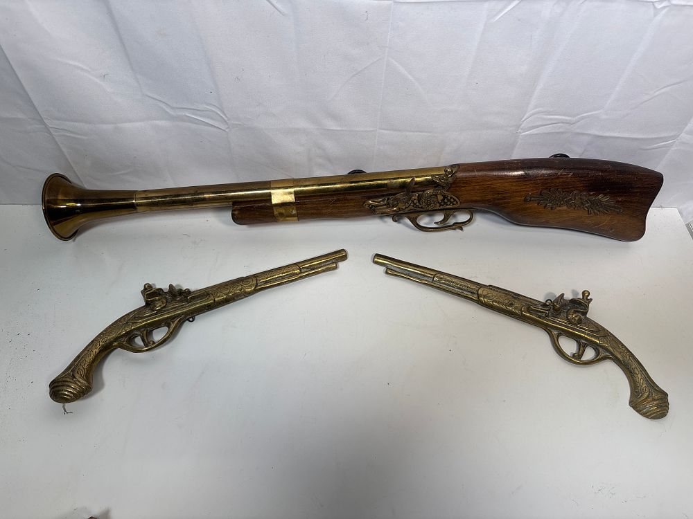 Lot 181: Brass Ornamental Blunderbuss ( 27” long) and Two Flatback Brass Pistols