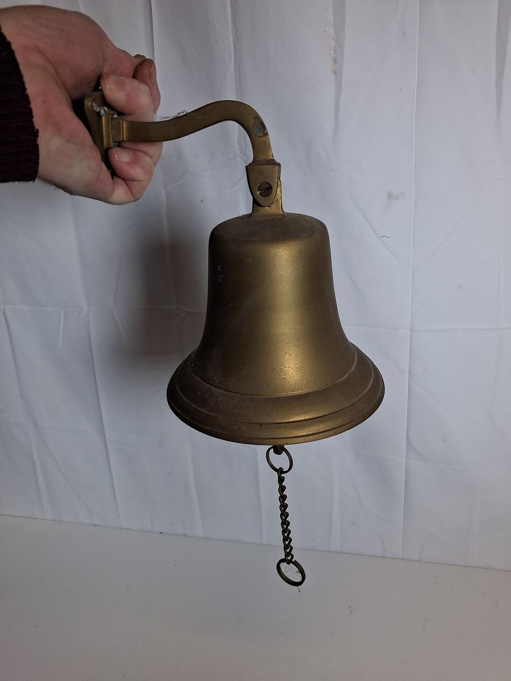 Lot 185: Brass wall hanging bell .