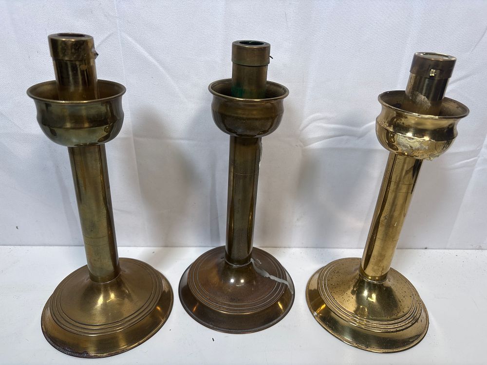 Lot 190: Trio of candle sticks in Brass