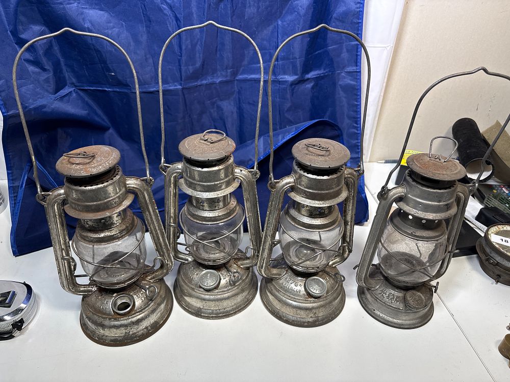 Lot 403: Four oil lamps