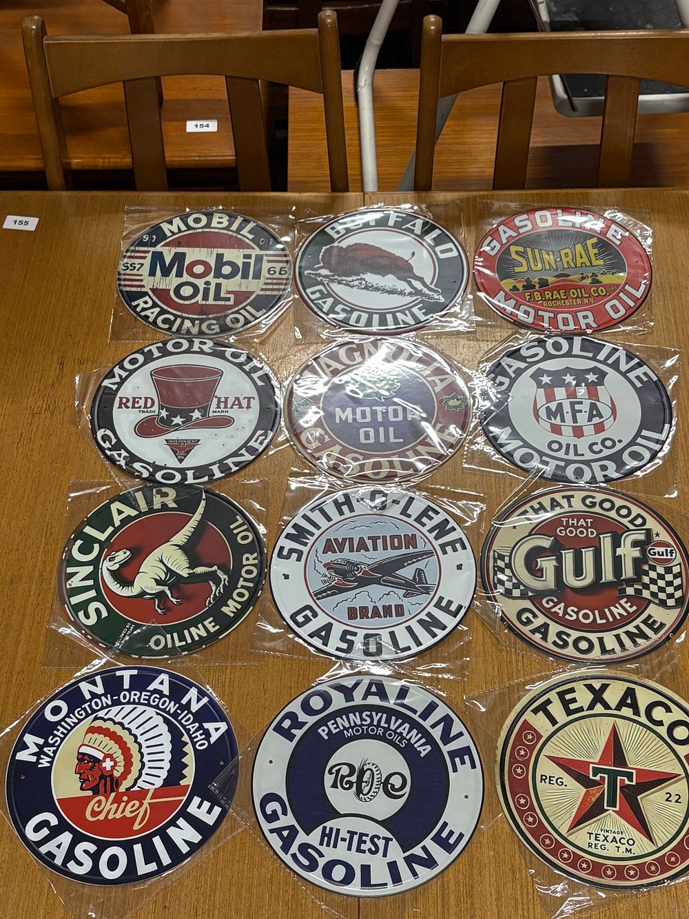 Lot 171: A Dozen 7” Diameter Man Cave Signs