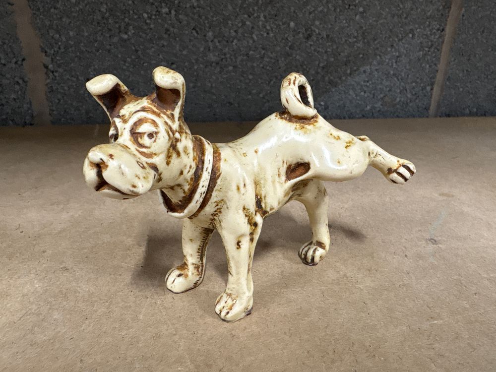 Lot 194: Sarcastic looking dog having a pee