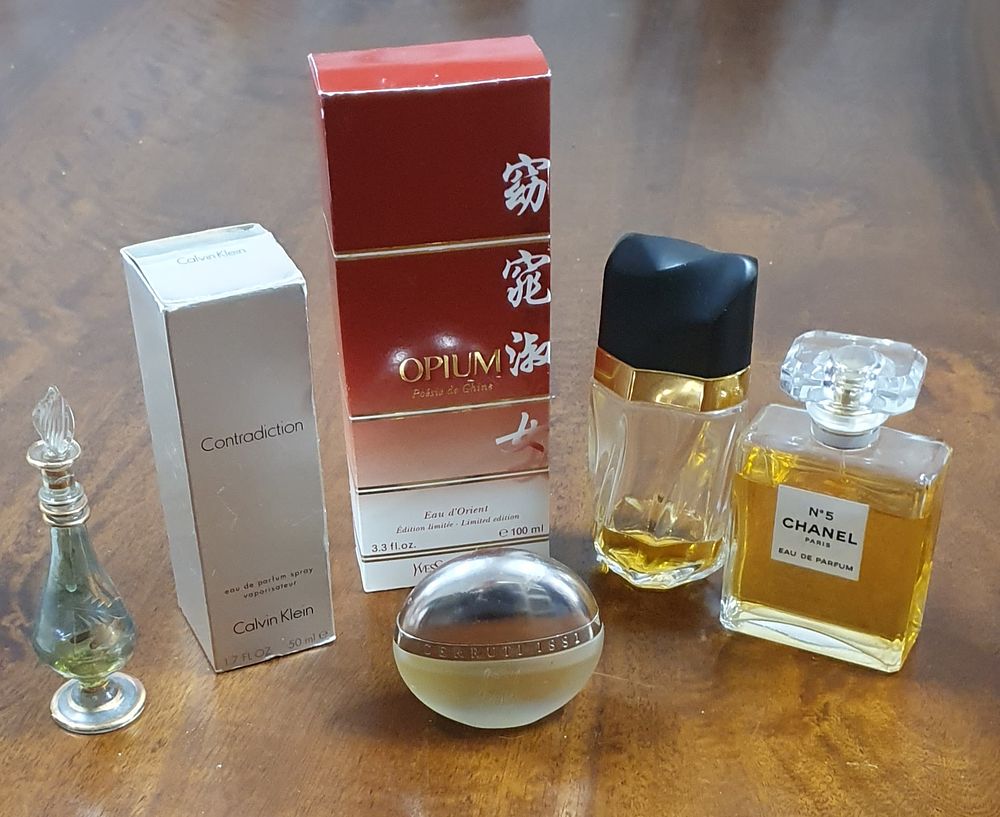Lot 228: Selection of used house clearance fragrances and scent bottle