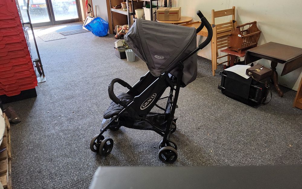 Lot 234: Graco travel lite stroller