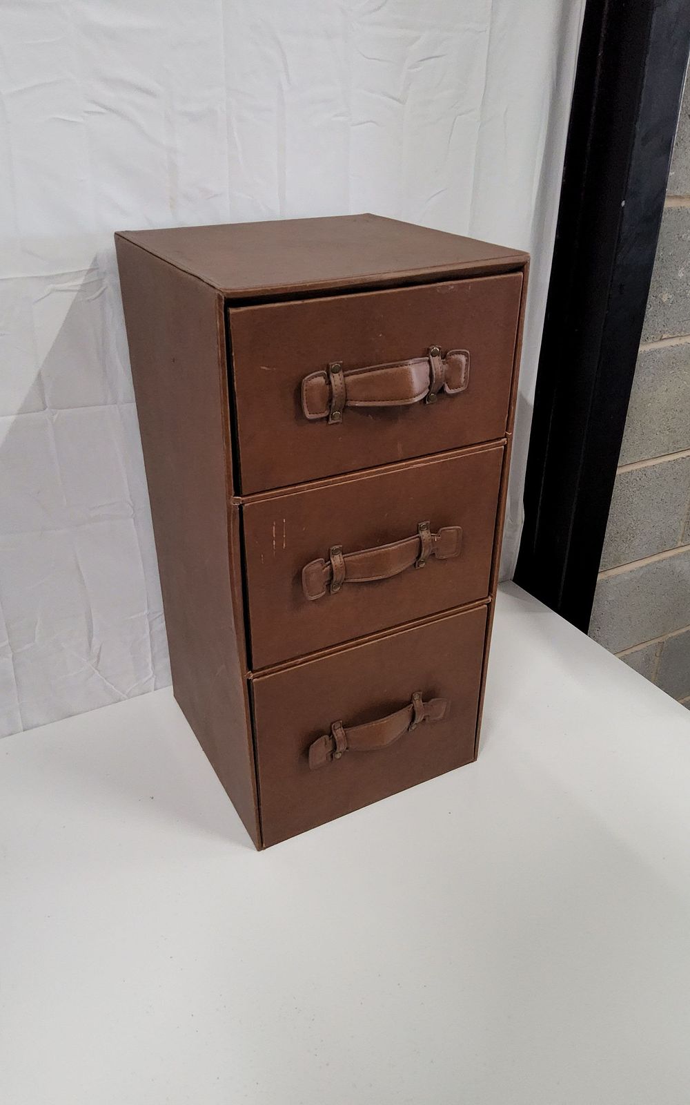 Lot 275: Brown leather 3 drawer storage
