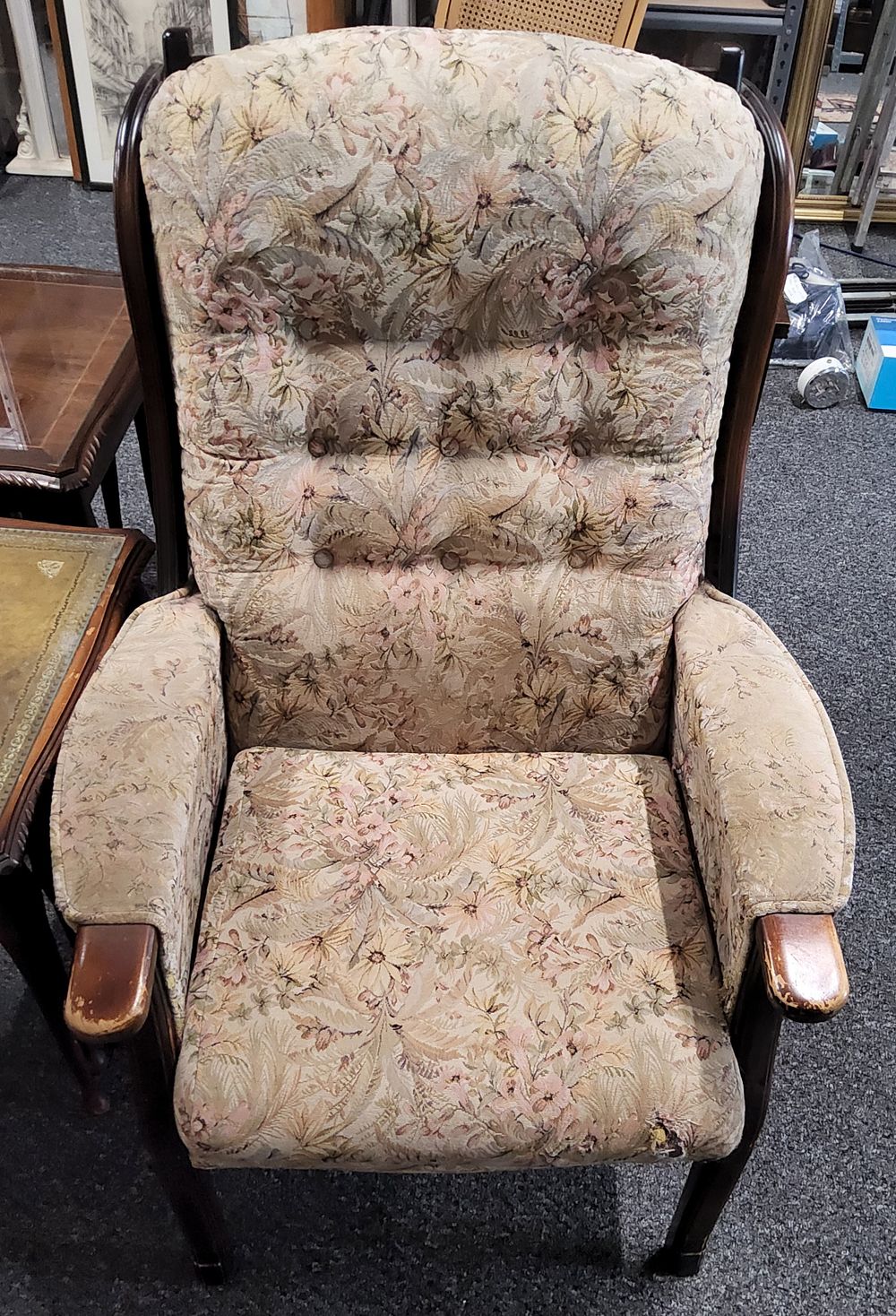Lot 195: High backed fireside chair.