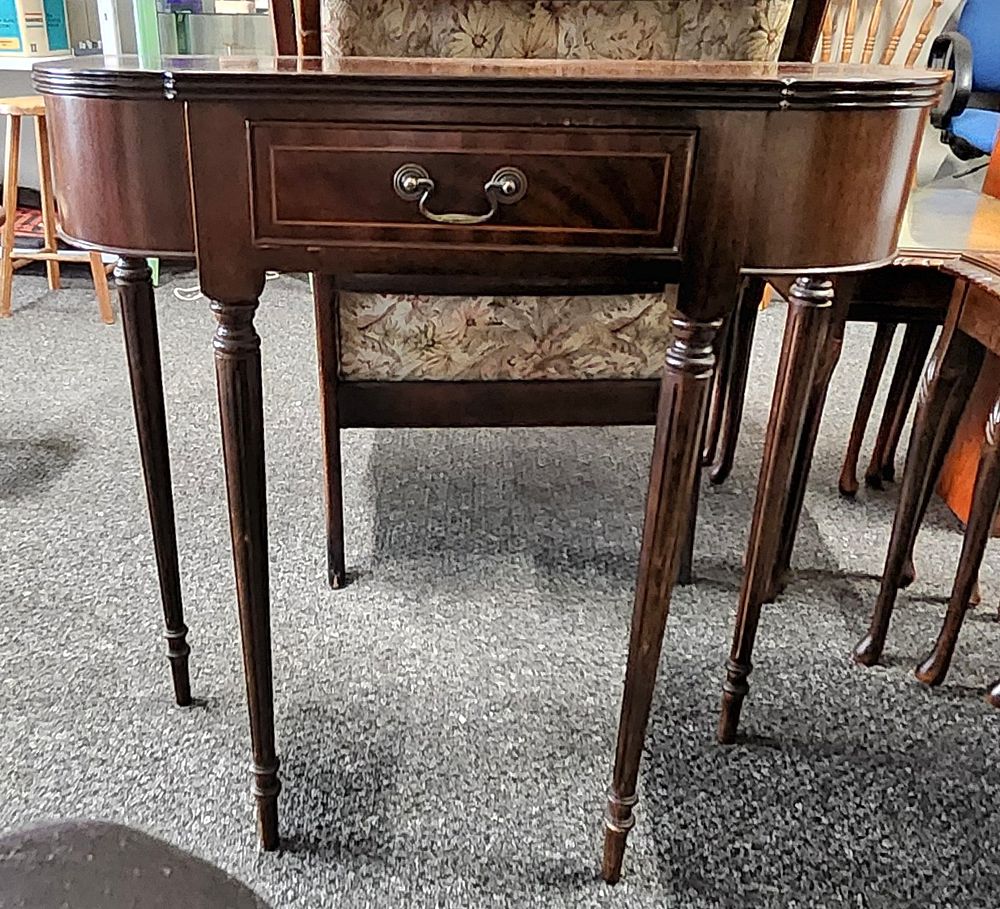 Lot 197: Bow fronted hall table.