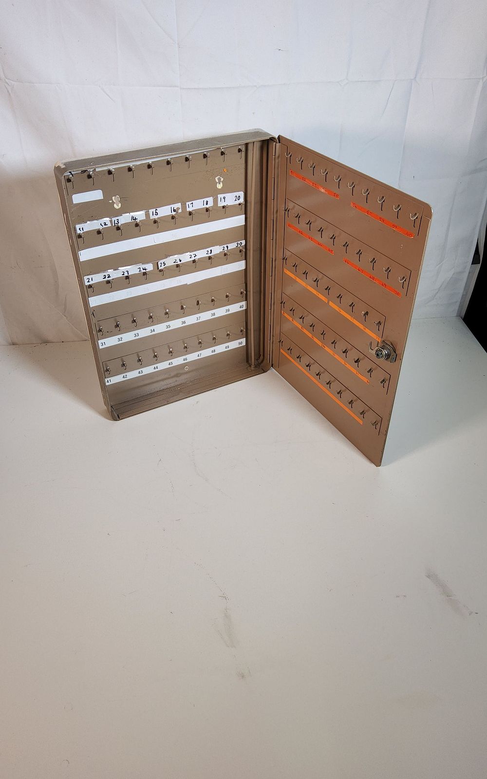 Lot 234: Wall hanging MYERS key safe, holds 100 keys no key so it would need a new lock or key cutting
Size H 15.5" x w 13"