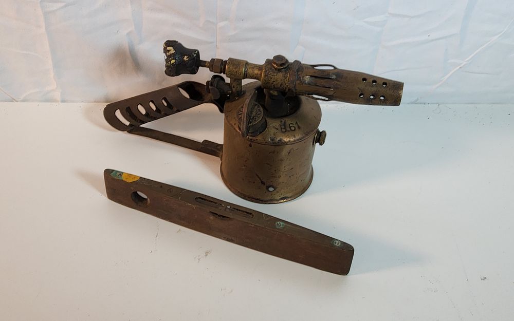 Lot 242: 2 Vintage Collectables brass B61 blow lamp and a brass and wood spirit level