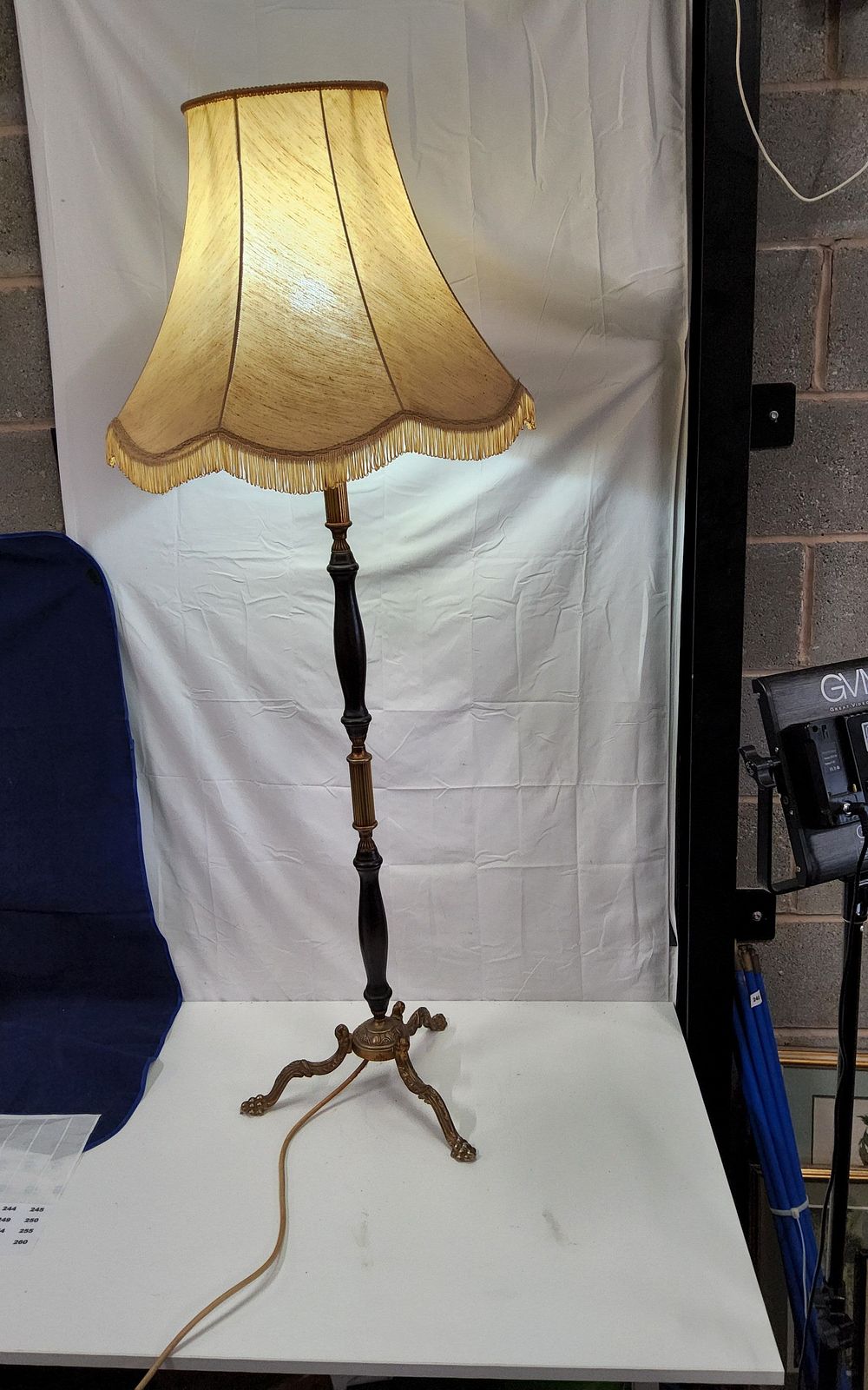 Lot 243: Vintage French Empire style standing floor lamp dark wood elements combined with ornate brass sections ( working when tested )