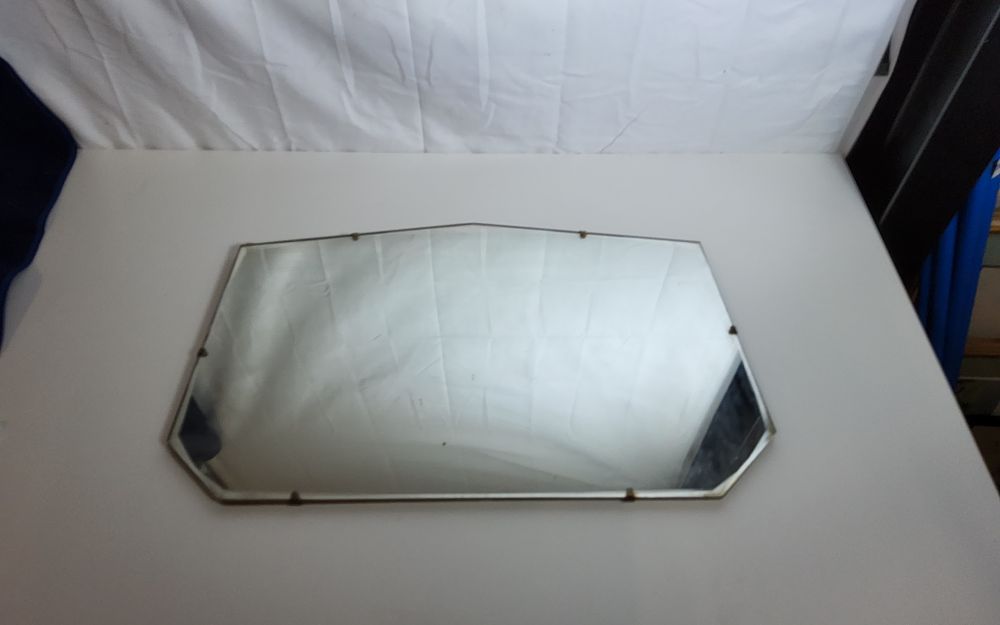 Lot 245: Vintage frameless beveled wall mirror, commonly featuring a style reminiscent of the art Deco perriod size L 20.5" x W 13"