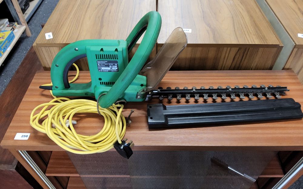 Lot 257: Electric hedge trimmer ( working when tested )