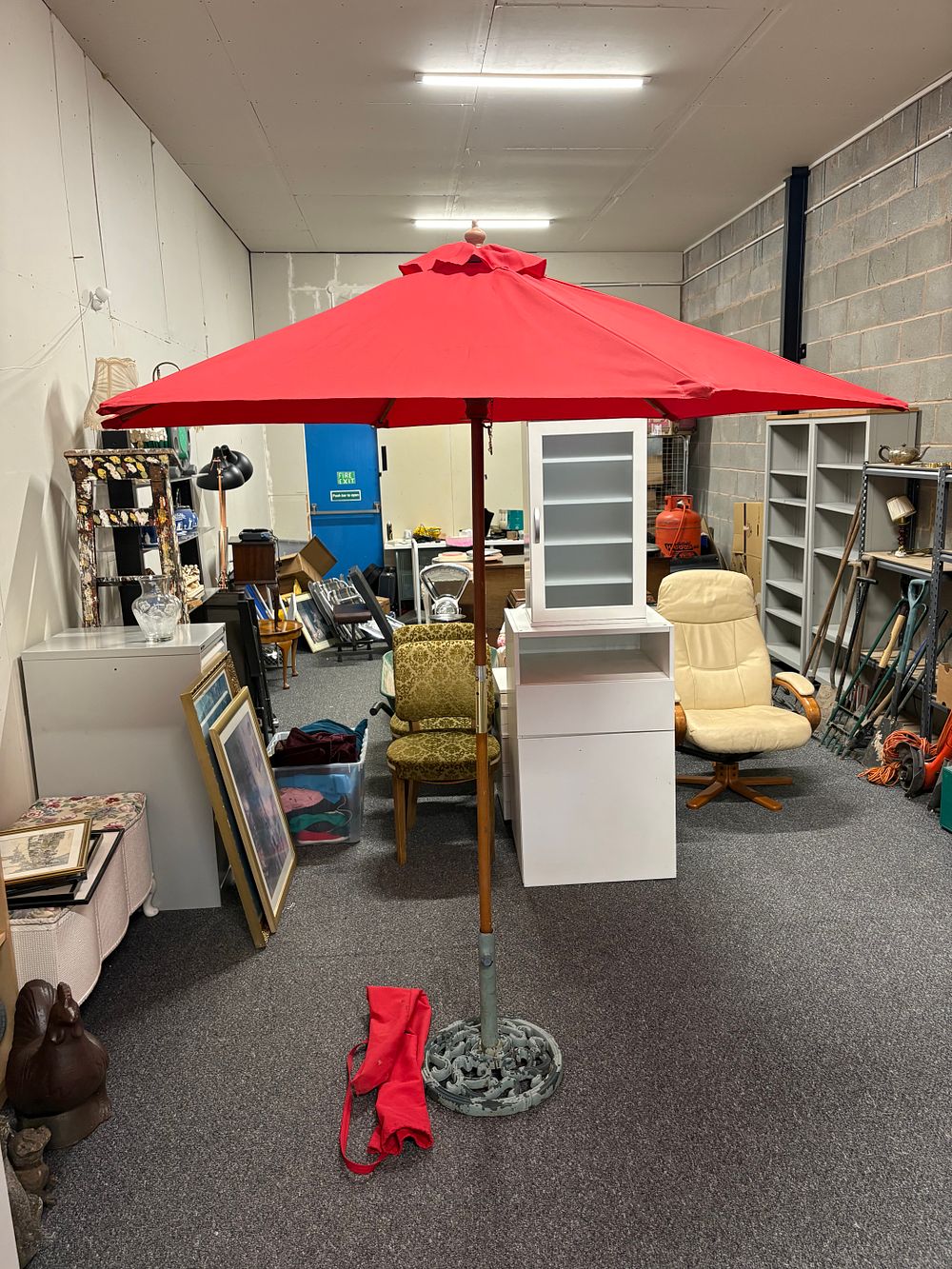 Lot 162: Large Red Parasol With Bag and Cast Iron Stand