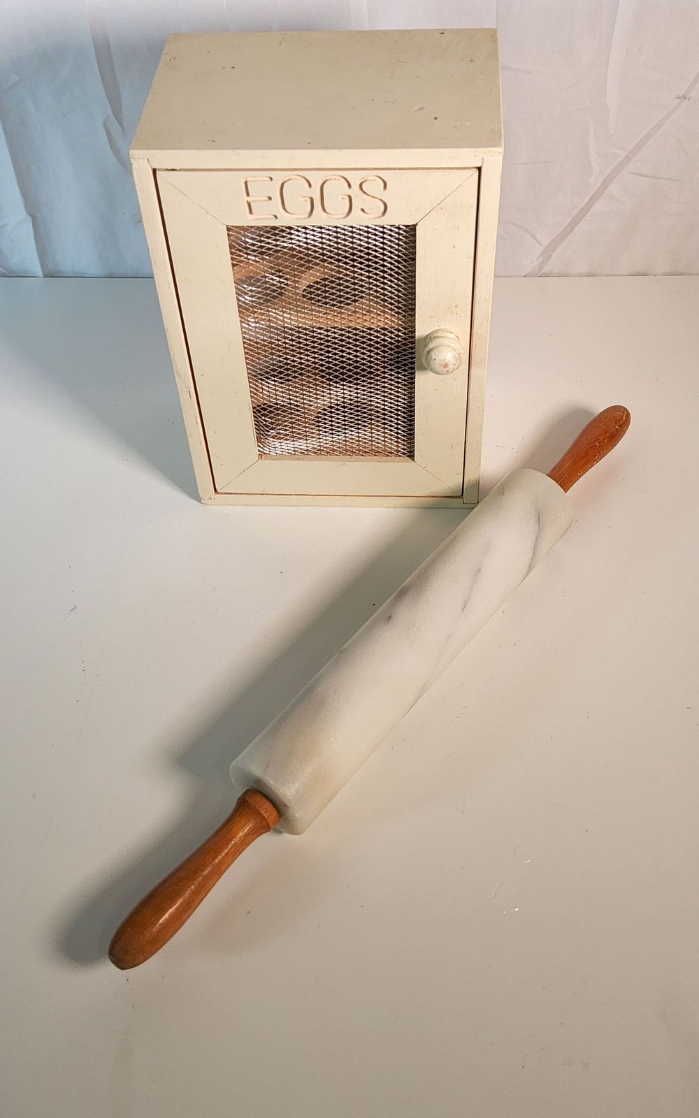Lot 56: Egg box & Rolling pin.