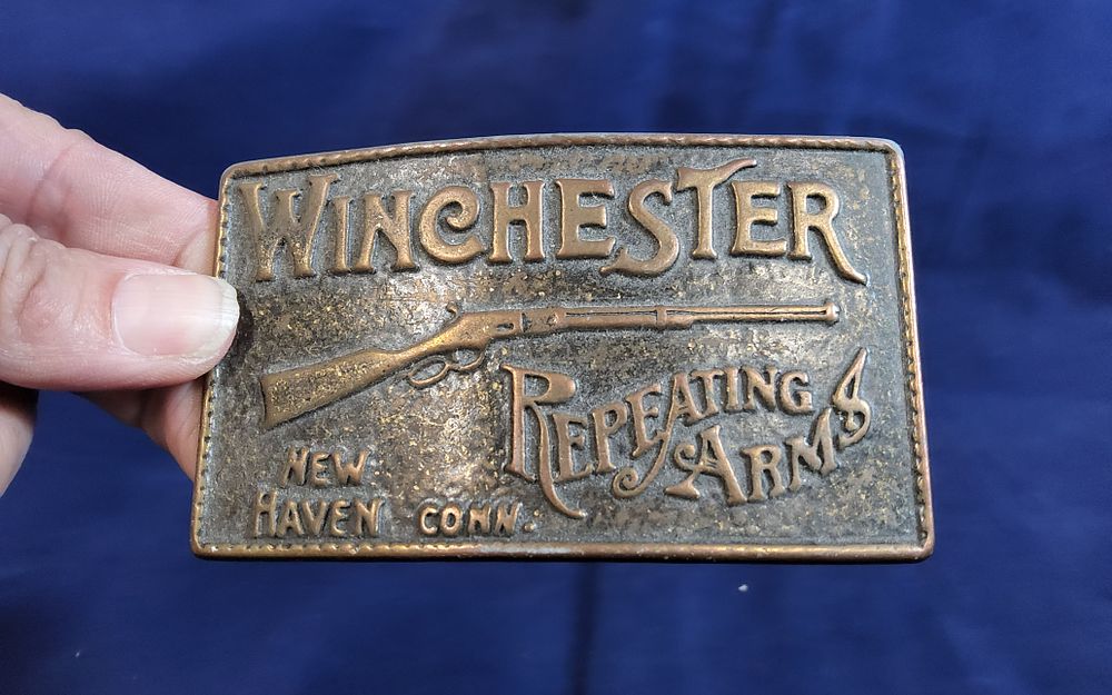 Lot 160: Vintage Winchester Repeating Arms belt buckle