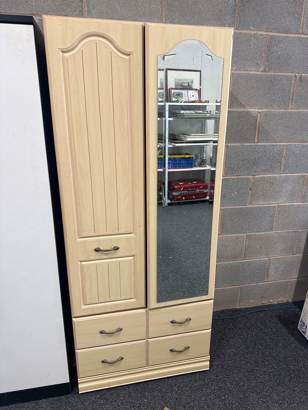 Lot 160: A contemporary light wood-effect two-door wardrobe with inset mirror and four drawers