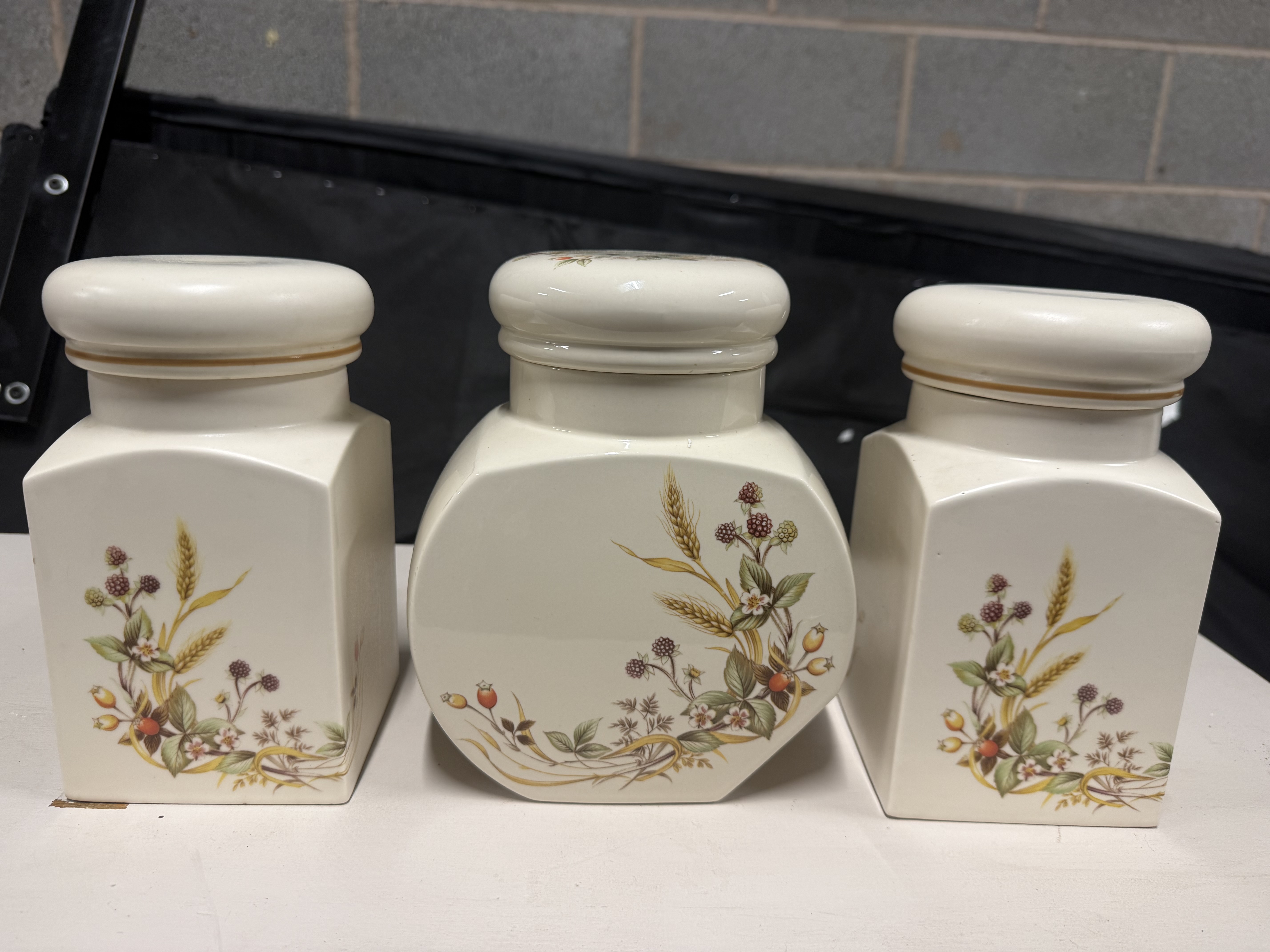A trio of Marks and Spencer Harvest pattern storage jars