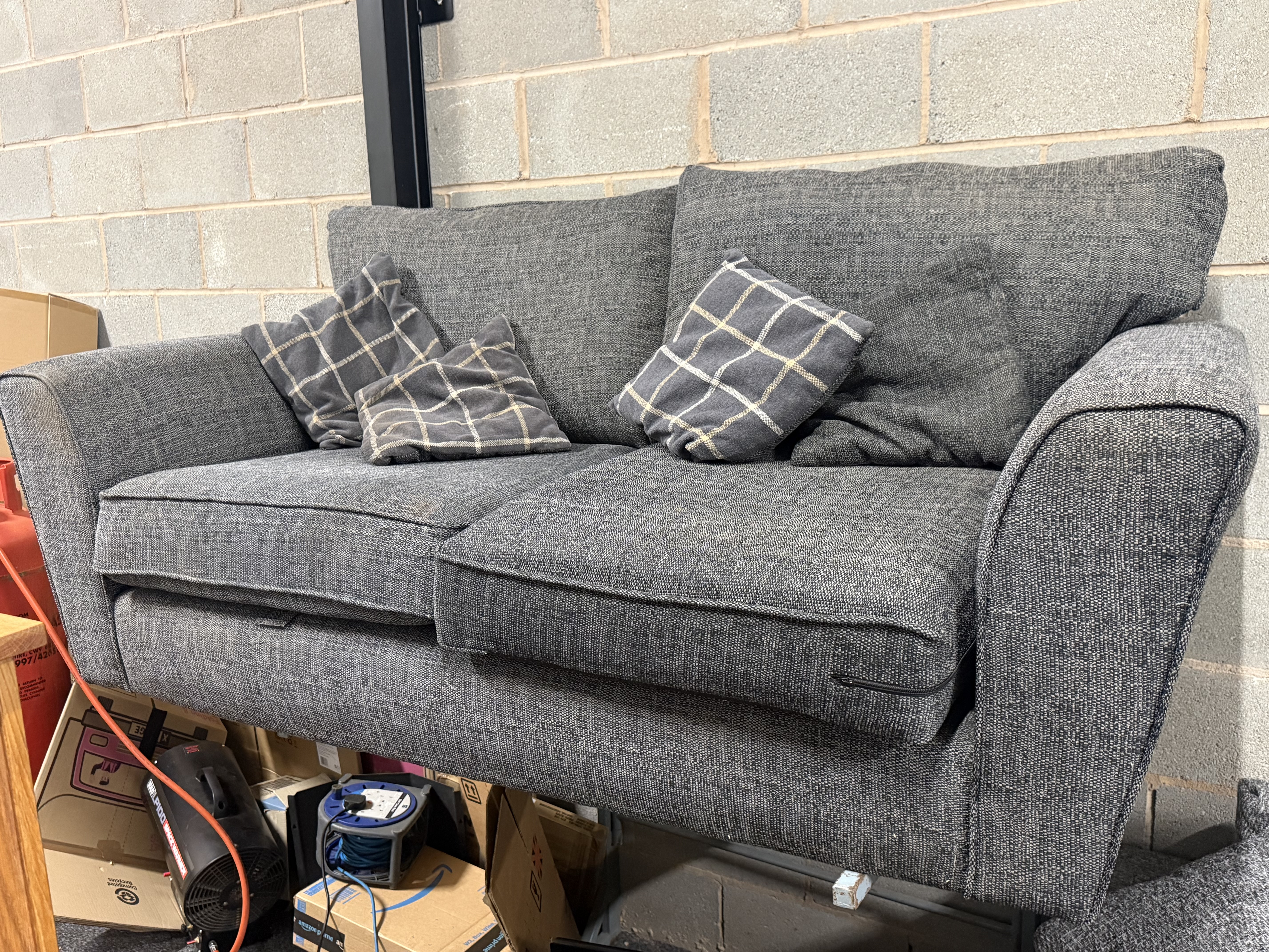 A contemporary grey woven fabric two-seater sofa by SCS