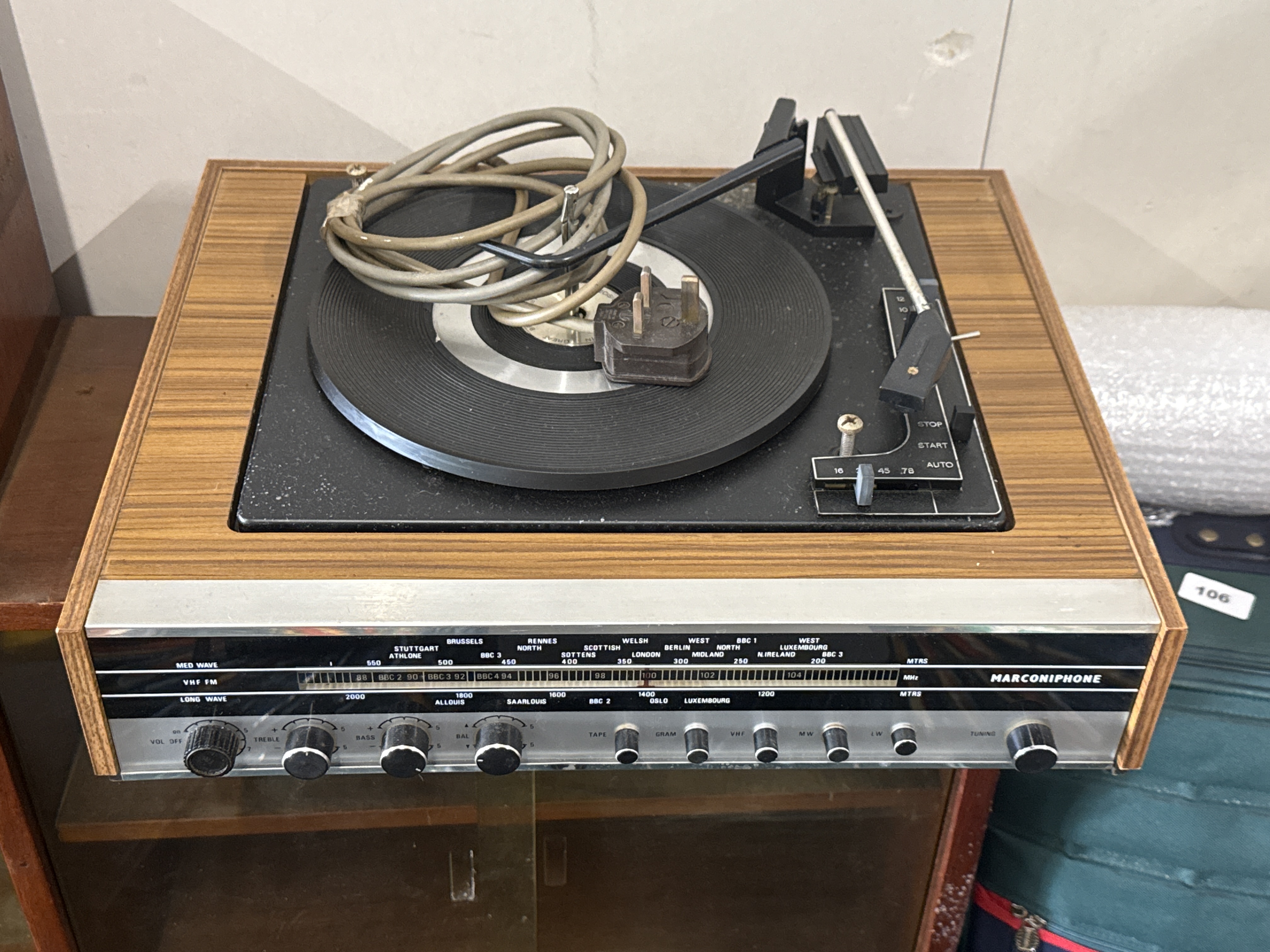 A vintage Marconiphone combined record player and radio receiver
