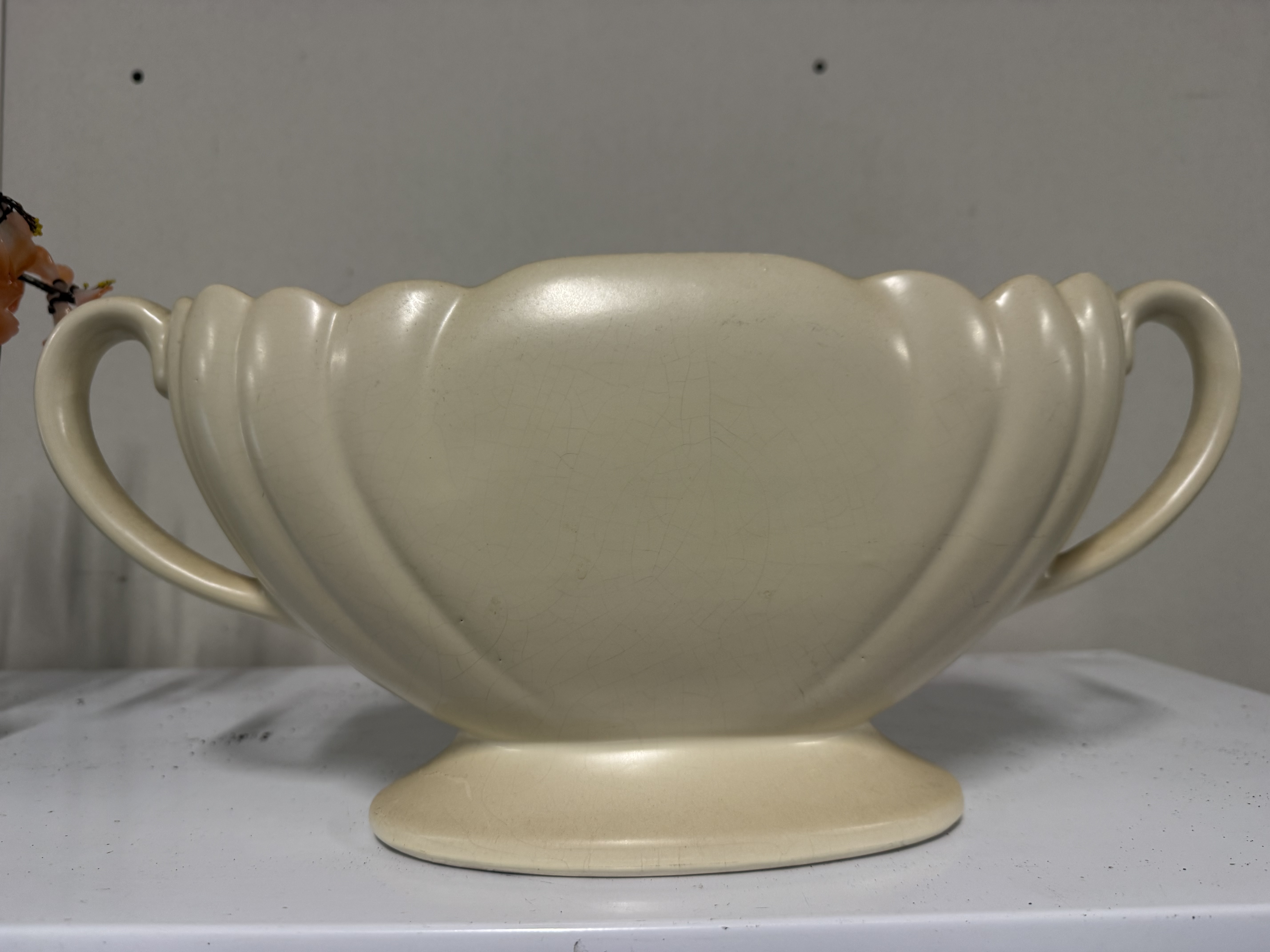 A Dartmouth Pottery Devon cream glazed twin-handled trophy vase