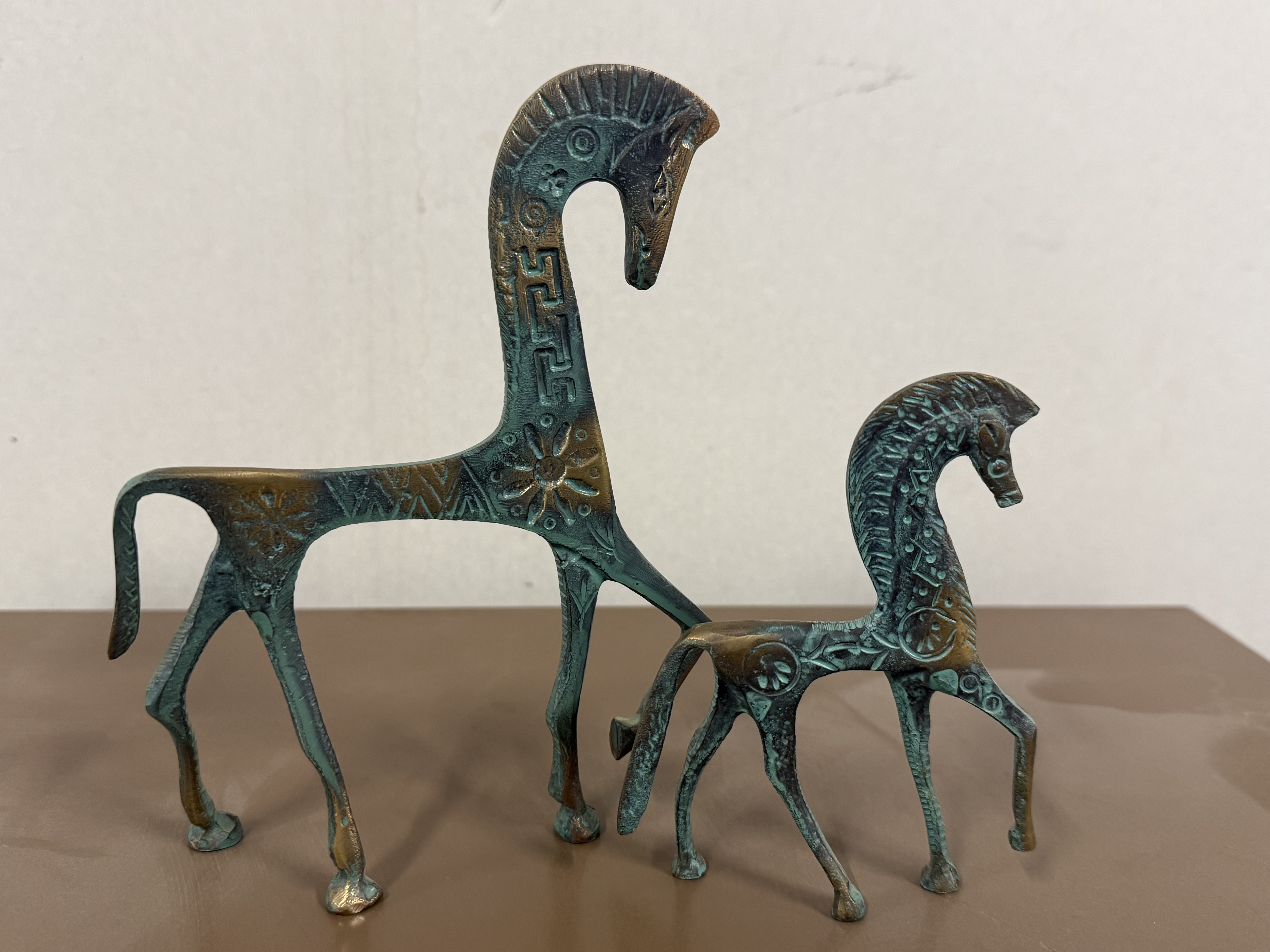 A Pair of Greek Geometric Bronzed Horse Figurines