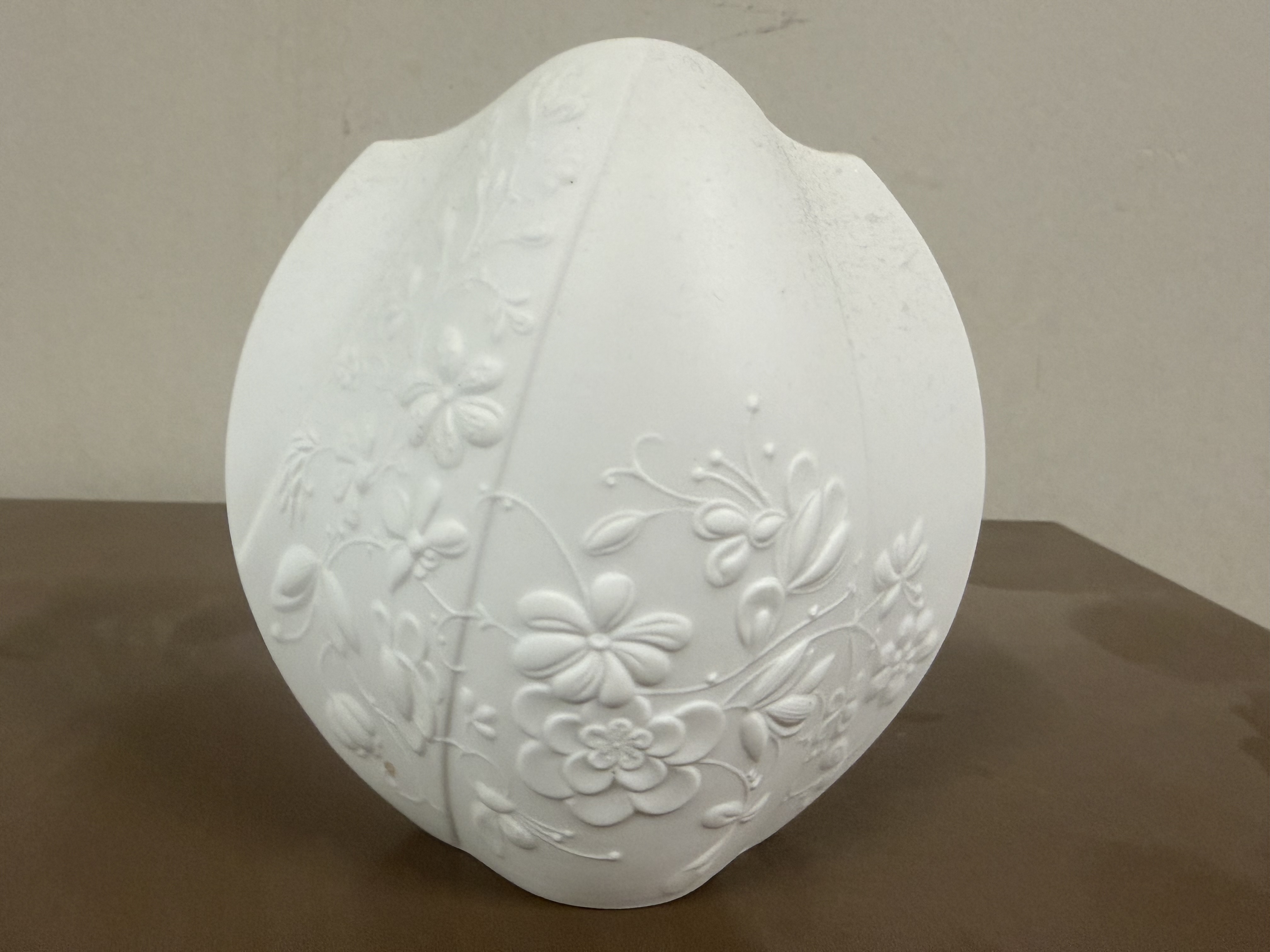 A Kaiser Germany white bisque porcelain floral relief vase