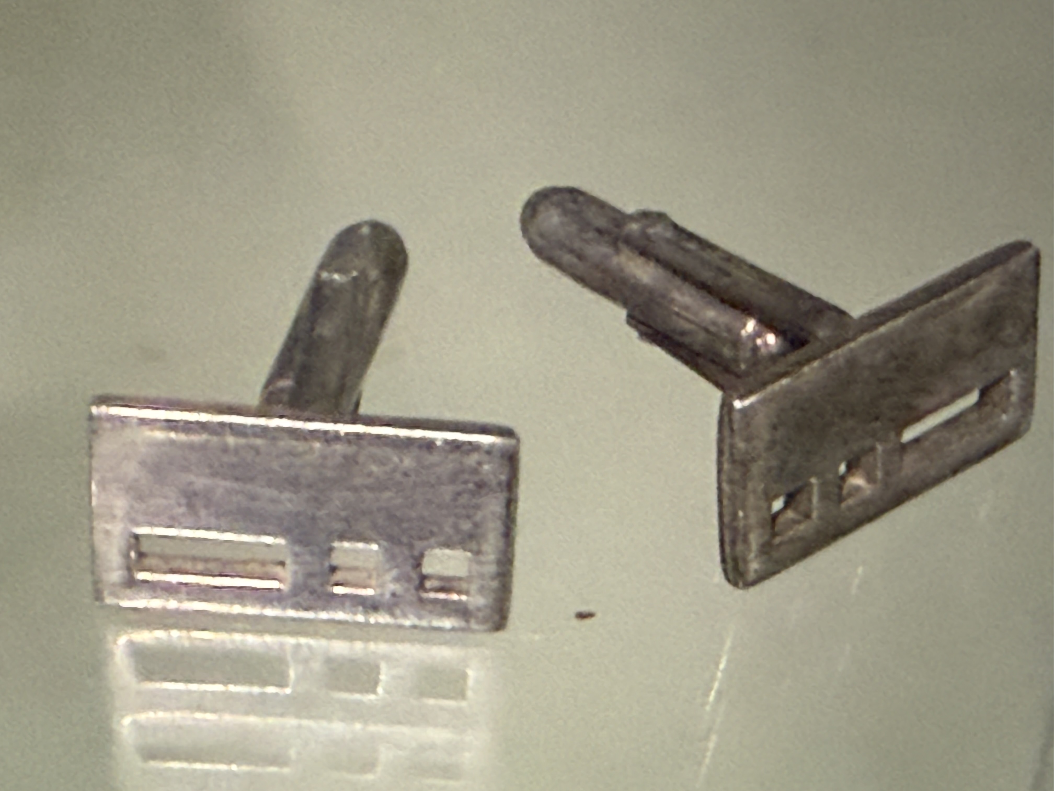 A Pair of Modernist Silver Toned Geometric Pierced Cufflinks